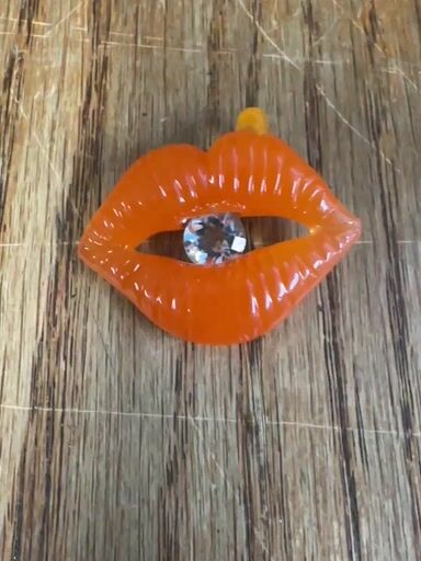 Preview pic of Corinne winters rare UV orange crush lips pendant with CZ center highly collectible new old stock